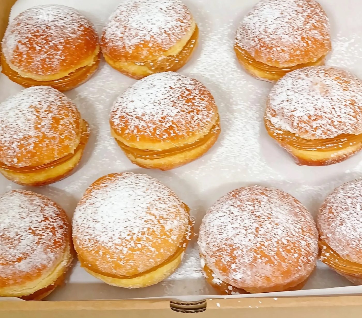 A tray of sugar-dusted sonhos